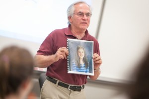 Ron Bersani holds a picture of his granddaughter, Melanie Powell, who was killed in a drunk driving accident in 2003. // PHOTO BY CONNOR GLEASON / CURRY COLLEGE.